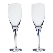 Orrefors Intermezzo Blue Collection designed by Erika Lagerbielke. From the name synonymous with unique and luxurious art glass, Orrefors' Intermezzo Blue has a distinct teardrop of blue in the stem.