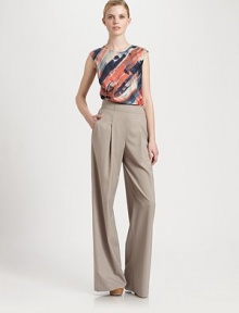 Phenomenally designed wool pants with well-placed pleats for high-fashion appeal. A hint of stretch offers an enviable fit.Waist dartsSide zipperSlash pocketsWide-leg styleInseam, about 33Rise, about 1396% wool/4% elastaneDry cleanImported of Italian fabric Model shown is 5'10 (177cm) wearing US size 4. 