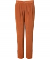 Inject a note of rich color into your favorite daytime staples with Antik Batiks rust silk pants, tailored to perfection for all-season sophistication - Button closure, side slit pockets, pleated front, buttoned ankles - Pair with breezy tops and blazers