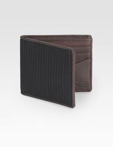 An inspired look based on a classic suiting pinstripe with a pebbled leather interior. Backed for stability and durability Bill compartment Six card slots About 4 X 3½ Imported 