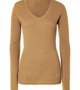 Elegant and ultra-flattering, this sumptuous cashmere pullover from Dear Cashmere is guaranteed to be a new-season staple - V-neck, long sleeves, slim fit, long body, rhinestone logo at hem - Pair with skinny jeans, a chunky cardigan, and high heel booties