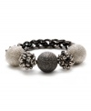 Sophisticated spheres make a stylish statement on this stretch chain bracelet from Kenneth Cole New York. Crafted in hematite tone and silver tone mixed metal. Bracelet stretches to fit wrist. Approximate length: 7-1/2 inches.