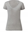 Stylish T-shirt made of fine, grey viscose - Very comfortable and light quality - With a feminine wide scoop neckline and short sleeves - Slim fitted at the waist - A dream basic, exactly what you are always looking for and need - Wear solo or as a layering piece - Fits with virtually all bottoms, a pant suit, shorts, a pleated skirt