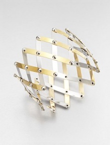 Silver studs connect bands of sterling silver, some with goldplating, in a striking wide, woven trellis pattern.Sterling silver and 18k goldplated sterling silverDiameter, about 4 (adjustable)Width, about 2¼Made in Italy