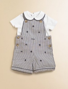 Preppy heritage style is adorably interpreted with an ultra-comfortable cotton jersey set that pairs a striped seersucker overall with a short-sleeved solid bodysuit. Overall Button-front shoulder strapsSleevelessSide buttons Bodysuit Peter Pan collarShort sleevesBack snapsBottom snapsCottonMachine washImported Please note: Number of buttons/snaps may vary depending on size ordered. Additional InformationKid's Apparel Size Guide 