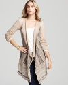 Metallic thread lends a subtle sparkle to this comfy Free People cardigan, cozy as a blanket yet chic for the workday.