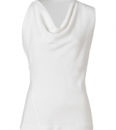 Lend a contemporary edge to polished day and evening looks alike with Donna Karans pristine white sculptural top - Draped neckline, asymmetrical sleeveless top - Form-fitting - Wear with a bright skirt, a blazer and pin heels