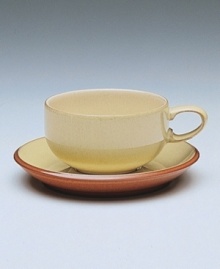 Warm, natural colors and a retro feel combine in this decidedly modern tea cup. From Denby's dinnerware and dishes collection.