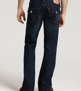 True Religion's bootcut, low rise jeans with signature horseshoes pocket styling and whiskering details in an indigo wash.