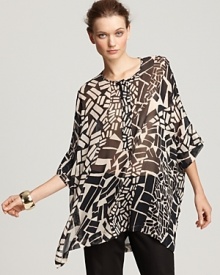 Update your print portfolio in this gossamer Lafayette 148 New York top, cut in a flowing silhouette and emboldened in a graphic geometric pattern.