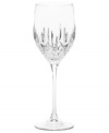 Set a table with enduring appeal. This classically elegant wine glass features intricately cut facets and graceful lines. Wine glass shown second from left.