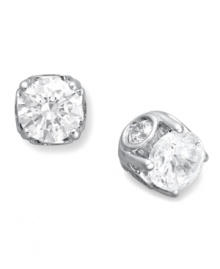 Traditional diamond stud earrings with an intricate twist. Each pair features a bezel-set diamond in the side, as well as a round-cut diamond at front (total 1/2 ct. t.w.). Set in 14k white gold. Approximate diameter: 4-1/10 mm.