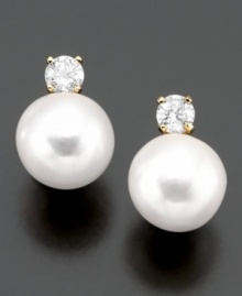 Classically beautiful jewelry with lasting style. These earrings feature cultured freshwater pearl (7-8 mm) and round-cut diamond (1/4 ct. t.w.) set in 14k gold.