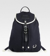 Whether on campus or off, tote your books, and the like, around in style with this vintage-inspired backpack crafted in durable cotton canvas.Flap, buckle closureDrawstring tieTop handleInterior zip pocketCotton14W x 16H x 5DImported