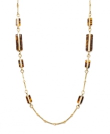 Neutral tones add a touch of warmth to your look. Lauren by Ralph Lauren necklace features trendy tortoise shell accents set in a delicate gold tone mixed metal chain. Approximate length: 36 inches.