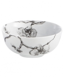 Compose a striking arrangement with the Black Orchid bowl by Michael Aram. Fine white Limoges porcelain flourishes under a dark watercolor motif inspired by foliage from around the world.