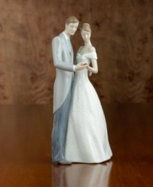 A beautiful wedding gift the happy couple will always treasure. Bride and groom dancing in glazed porcelain. Stands 8.25 tall.