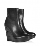 An edgy, sculptural wedge heel informs these ultra-versatile leather wedge booties from Diane von Furstenberg - Round toe, front platform, layered wedge heel, ankle length, side zip closure, textured leather - Pair with skinny jeans and an oversized pullover or with a printed mini-dress and ribbed tights