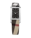 Ladies small silvertone rectangular dial watch on the nova check curved strap. Stainless steel backing. Sunray silver dial with 12 applied silver indices and twill effect inside frame. Nova check strap with deployant buckle.