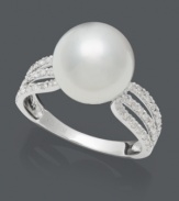 Polish and prestige. This luminous ring by Belle de Mer epitomizes elegance with a cultured freshwater pearl center (10-11 mm) surrounded by three rows of sparkling, round-cut diamonds (1/4 ct. t.w.). Setting crafted in 14k white gold.