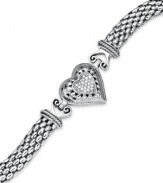 A romantic accent. This chic, heart charm bracelet is outlined by sparkling round-cut diamonds (1/6 ct. t.w.) with a trendy mesh chain. Set in sterling silver. Approximate length: 7-1/2 inches.