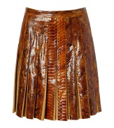 The ultimate showstopper! This ultra-luxe python and suede pleated skirt from Salvatore Ferragamo begs to be shown off in style - Fitted waist, allover pleating, concealed side zip closure, made with supple suede and glossy python - Flared silhouette - Wear with a cashmere turtleneck, a neutral-hued cape, and classic pumps