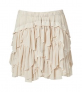 Imbue your look with flirty style with this ultra feminine ruffled skirt from Antik Batik - Elasticized waistband, front tiered ruffles, asymmetrical hem - Pair with a worn-in tee, a draped front leather jacket, and platform ankle booties