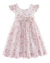 A charmingly traditional dress in crisp cotton features a dogwood floral pattern for a sweet summer look.