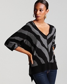 An exotic-stripe Plenty by Tracy Reese sweater lends fierce style to your favorite denim styles, taking them from off-duty to after-hours in seamless fashion. Accent the look with towering booties and an armful of bangles for a dose of glam.