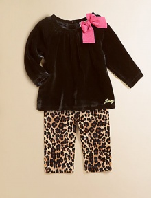 A plush velour tunic is adorned with a standout bow and Juicy signature and paired with cheetah-printed leggings for a wild ensemble.Round neckline with bowLong sleevesBack buttonsGathered bodicelLogo on hemElastic waistbandAnkle button detailCotton/SpandexMachine washImported Please note: Number of buttons may vary depending on size ordered. 