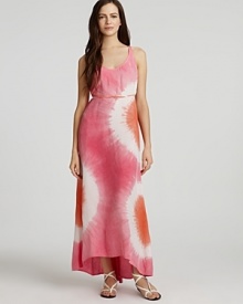 Adopt a cool attitude in C&C California's boho-chic tie dye maxi. The silk, racerback style boasts a tie at waist and asymmetric hem for modern appeal.