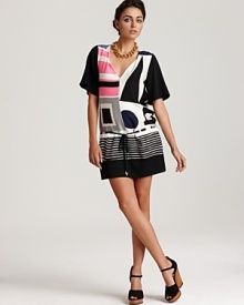 A DIANE von FURSTENBERG short sleeve dress features a bold geometric print for sharp edge with a downtown vibe. Rendered in luxe stretch silk, the modern creation flaunts a drop waist and side pockets to store your most treasured style essentials.