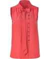 Detailed with a button and looped front panel (which lets you decide how tailored you want to wear it), Marc by Marc Jacobs sleeveless silk top is a unique feminine staple with endless wearing possibilities - Stand-up collar with tie, V-neckline, sleeveless, gathered yolk, front panel with button and loop detail, pull-over style - Loosely fitted - Wear with a boyfriend blazer, dark-wash skinnies and heels