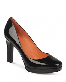 Via Spiga lends these work-ready platform pumps extra polish, in shining patent leather.