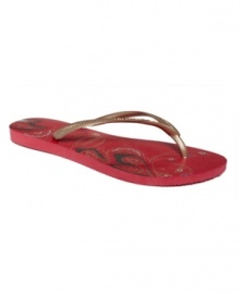 Dream of wildflowers. A flowery footbed spices up these classic rubber flip flops by Havaianas.