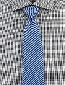 Bold stripes in oceanic hues define this timeless style of fine Italian cotton. CottonDry cleanMade in Italy