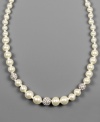 Improve your look with easy elegance. This Givenchy necklace is crafted in glass pearls, crystal accents and mixed metal. Approximate length: 16 inches.