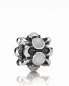 A ring of sterling silver flowers is punctuated with elegant white agate stones. Charm by PANDORA.