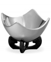 Set or simply decorate the table with the ultra-modern Anvil Scroll bowl from Nambe. A sculptural, iron-finished base cradles contoured silvertone alloy in this innovative Neil Cohen design.