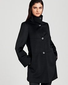 A feminine A-line silhouette lends a ladylike look to Armani's virgin wool coat--horizontal seaming details lend a modern look.