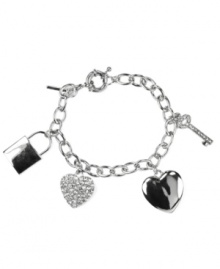 Perfectly charming! Heart, lock and key charms adorn this chic charm bracelet from Nine West. Embellished with sparkling pave crystals, it's set in silver tone mixed metal. Approximate length: 7-1/2 inches.