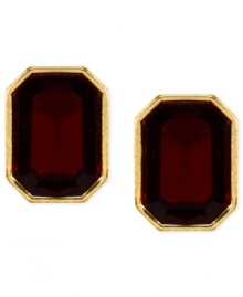 Red and gold lend a look of vibrant elegance. These stud earrings from Anne Klein features faceted red stones in a golden setting. Crafted in gold tone mixed metal. Approximate diameter: 1/2 inch.