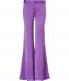 Stylish pants in fine purple silk - From the French luxury label Balmain - New, wide flared leg silhouette with figure-flattering creases - Crazy trendy and casual - A blockbuster basic for everyday - Pair with a beige tie blouse and pumps