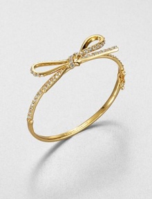 From the Skinny Mini Collection. A dainty bow, outlined in sparkling crystals, is like gift wrapping for your wrist.CrystalGoldtoneDiameter, about 2.25Hinged with push-lock safety claspImported