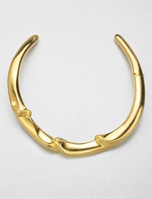 From the Miss Havisham Collection. A stunning yet simple sculpted design adds a golden gleam at the neck.GoldtoneLength, about 15Diameter, about 4.4Hinged at one sideImported