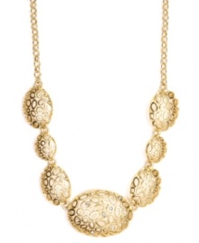 Dramatic design combines with subtle shimmer. Jones New York necklace features an intricate mix of asymmetrical circles and ovals with a sporadic dusting of round-cut crystals. Crafted in gold-plated mixed metal. Approximate length: 17 inches + 2-inch extender. Approximate drop: 1 inch.