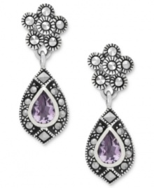 Shapely sophistication. Genevieve & Grace's teardrop earrings, crafted from sterling silver, get a vibrant touch with marcasite and stunning amethyst (5/8 ct. t.w.). Approximate drop length: 1-1/8 inches. Approximate width: 3/8 inch.