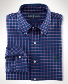 Tailored from smooth mercerized cotton twill in a colorful plaid print, the handsome trim-fitting sport shirt exudes timeless preppy style.