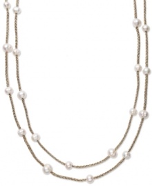 True treasures of the deep. Cultured freshwater pearls (8-10 mm) make a strong statement upon intricately woven gold tone polyester thread. Necklace is long enough to wrap twice for added volume. Approximate length: 64 inches.