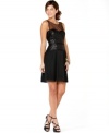 A little black dress with big impact: BCBGMAXAZRIA outfits this one with a bustier-style sequined bodice and a beautiful pleated skirt. Sheer fabric at the chest is a touch that makes this look smolder!